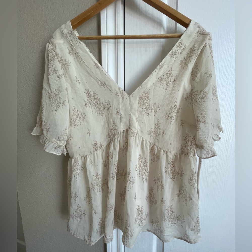 White Top with Floral Details